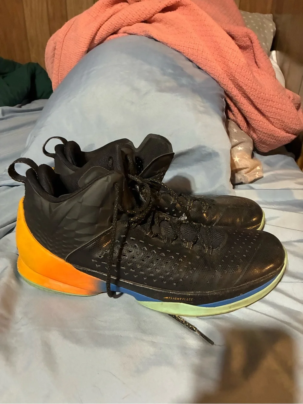 Black Basketball Jordans with Orange Heel Accent